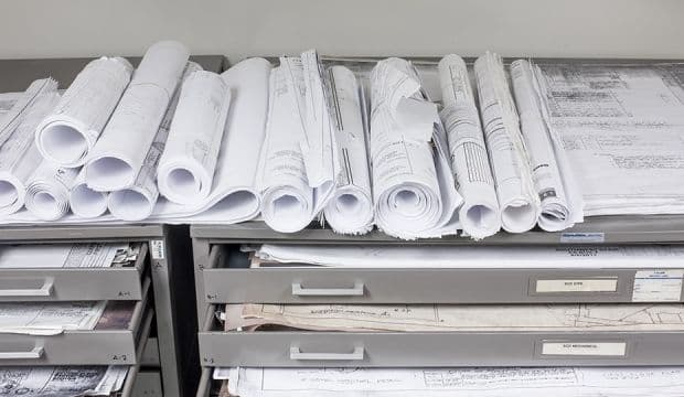 Floor plan blueprints on a desk